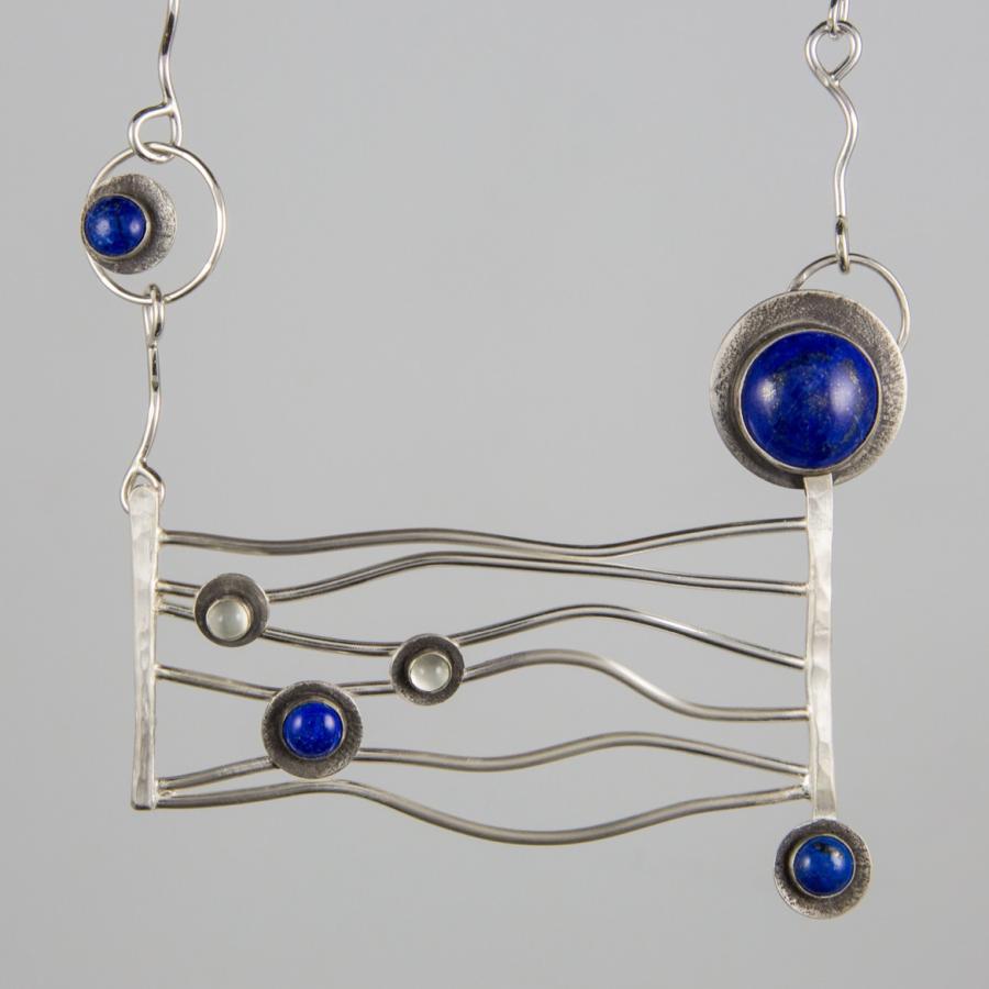 Handmade necklace with silver and blue stones.