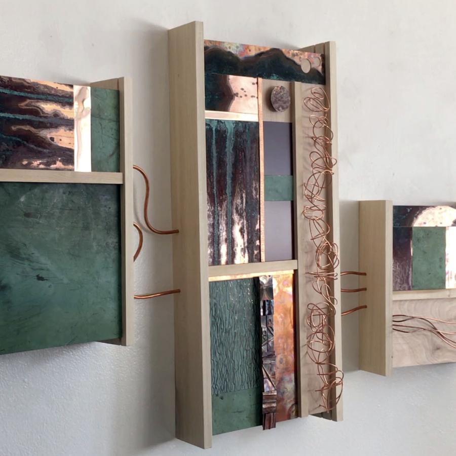 Abstract metal and wood wall art.