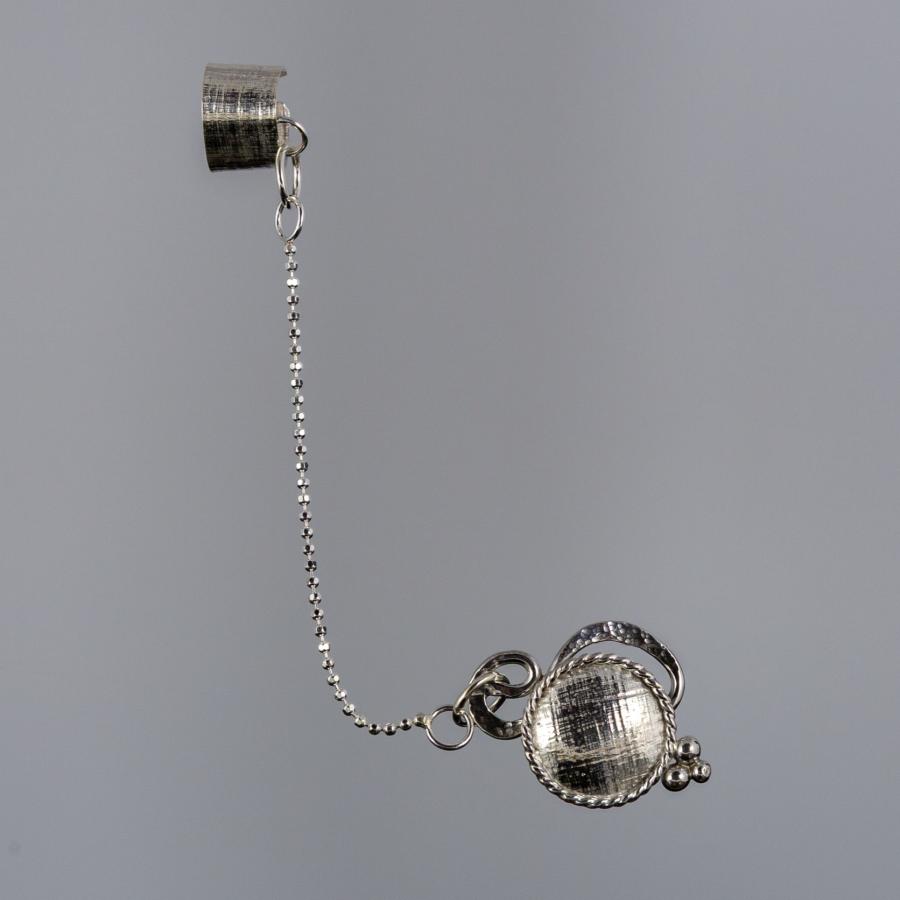 Earring with an attached ear cuff.