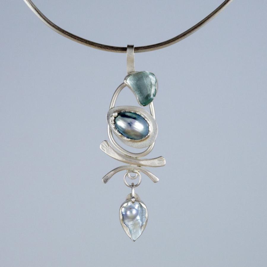 Silver pendant with blue stones