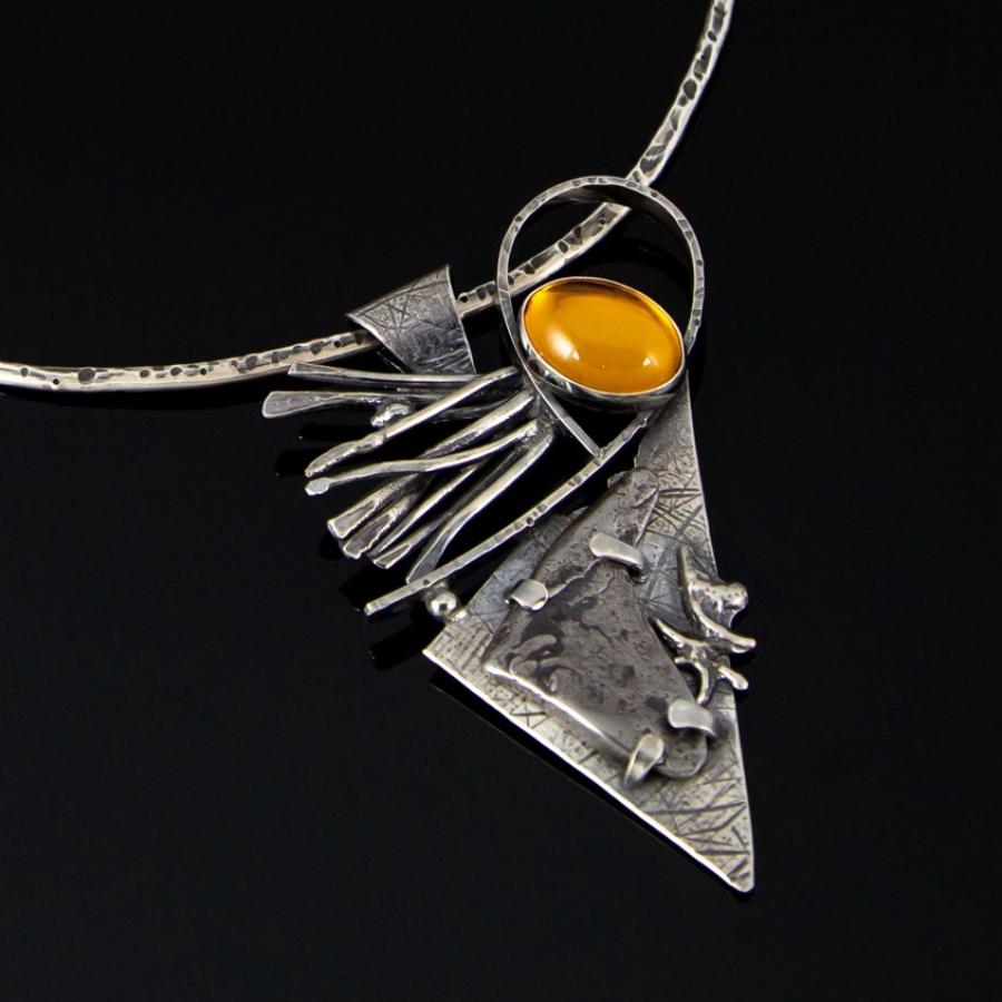 Silver pendant with yellow stone