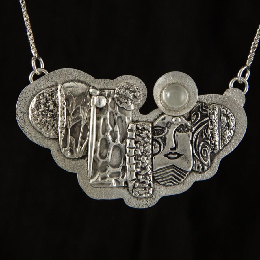 Sculptured silver pendant
