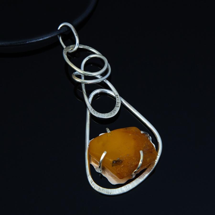 Silver pendant with yellow stone