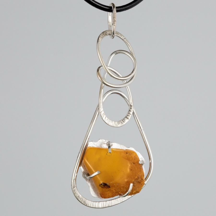 Silver pendant with yellow stone