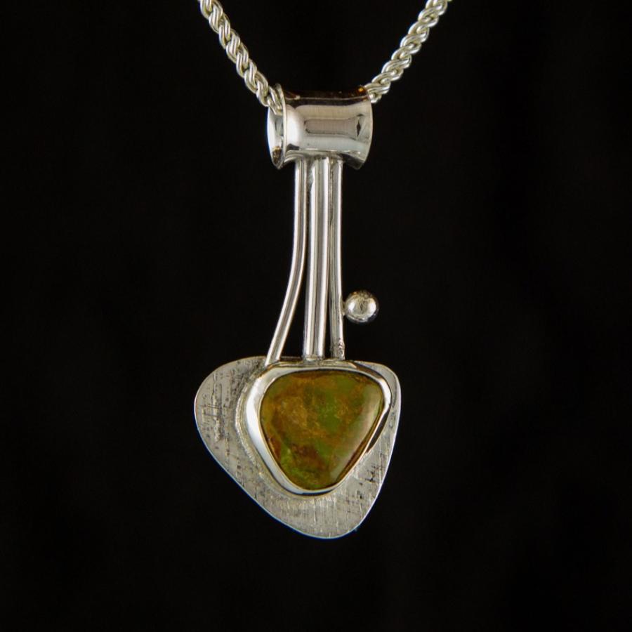 Silver pendant with brown, green stone