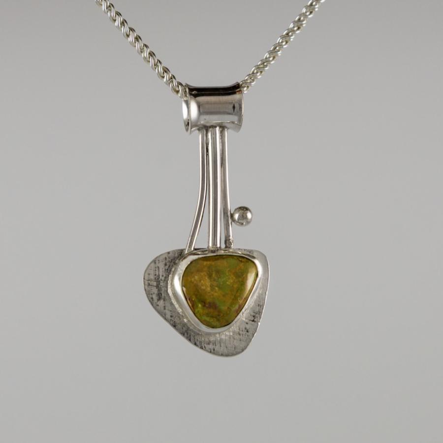 Silver pendant with brown, green stone