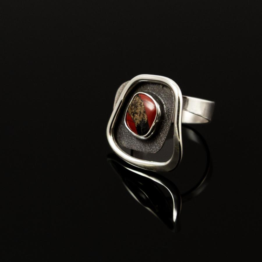 Silver ring with red stone