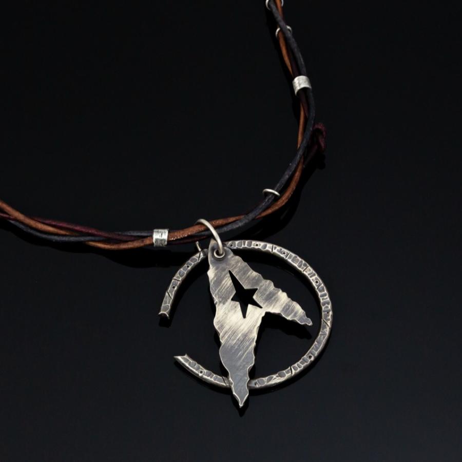 Silver pendant on leather cords