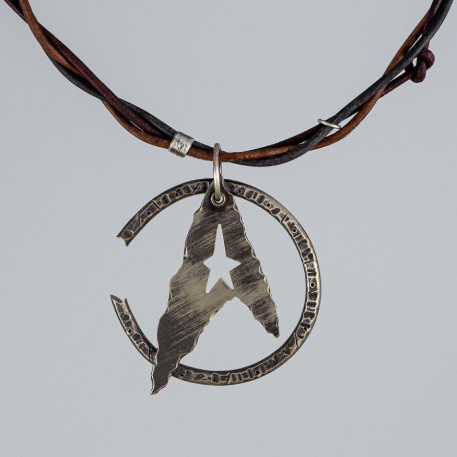 Silver pendant on leather cords