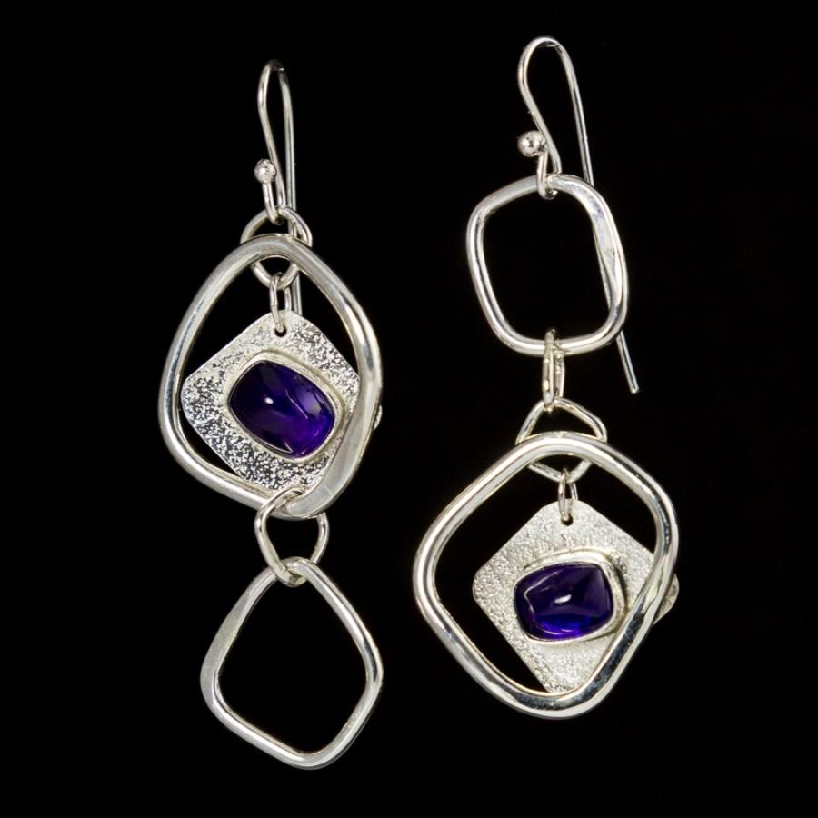 Silver earrings with purple stones