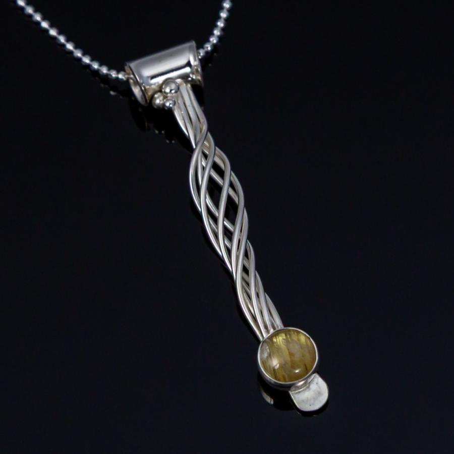 Silver wispy pendant with a yellow stone