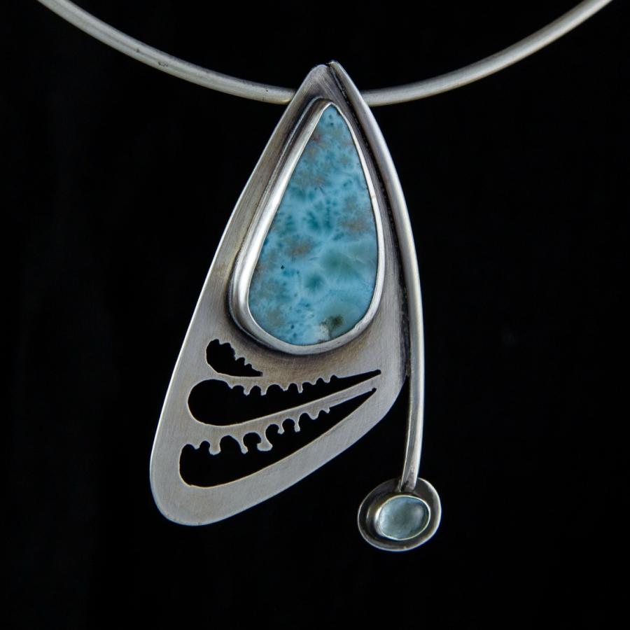 Silver pendant with blue stones