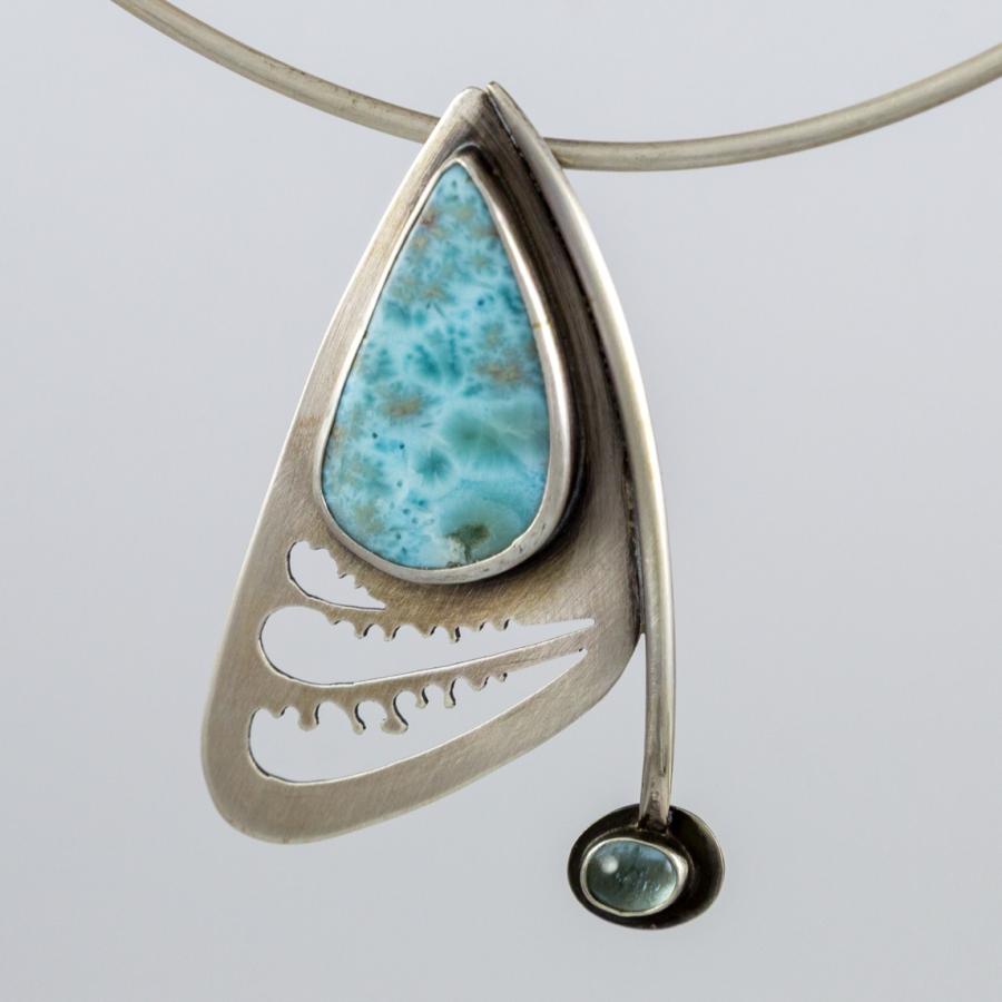 Silver pendant with blue stones