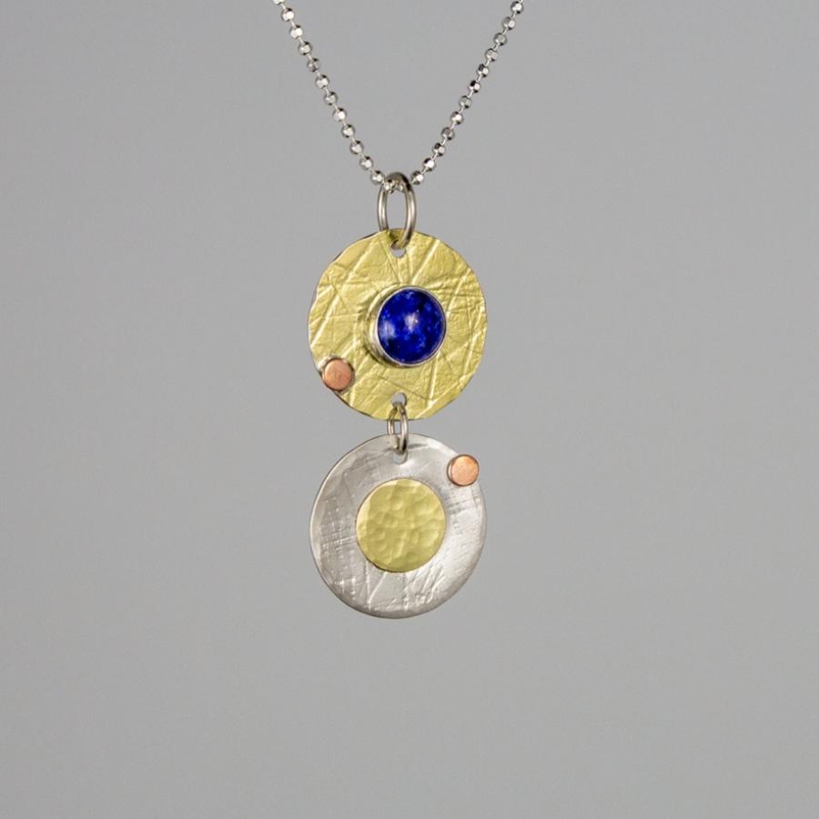 Gold, silver and copper pendant with blue stone