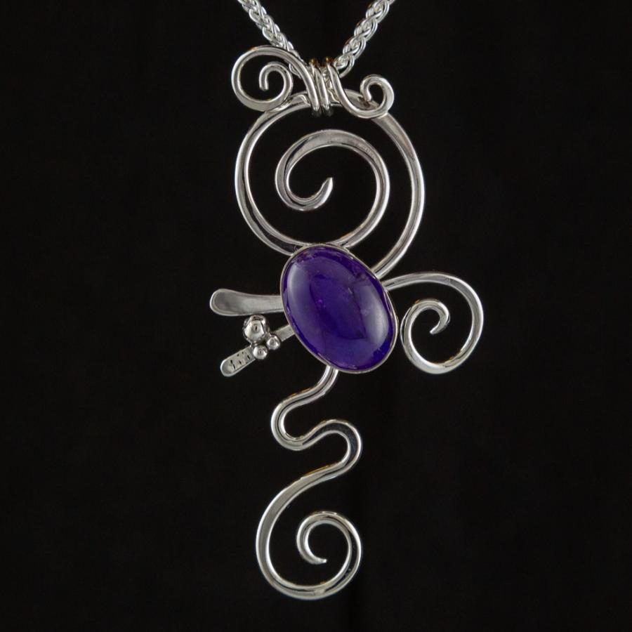 Silver pendant with purple stone