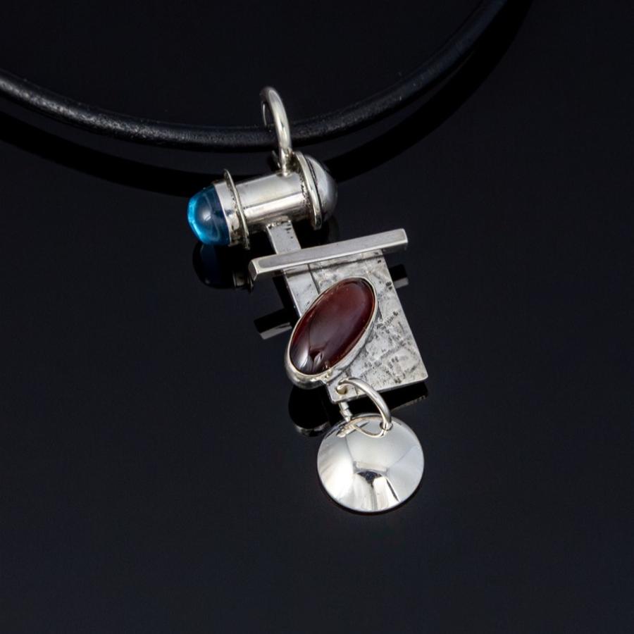 Silver pendant with red and blue stones