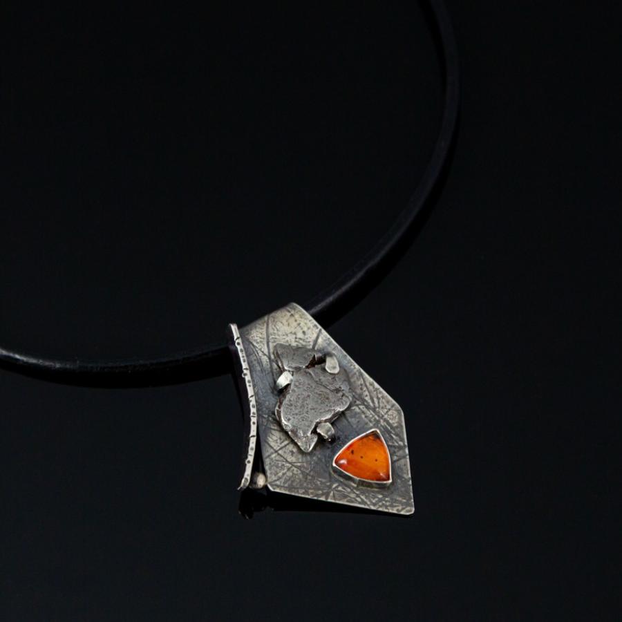 Silver pendant with an orange stone