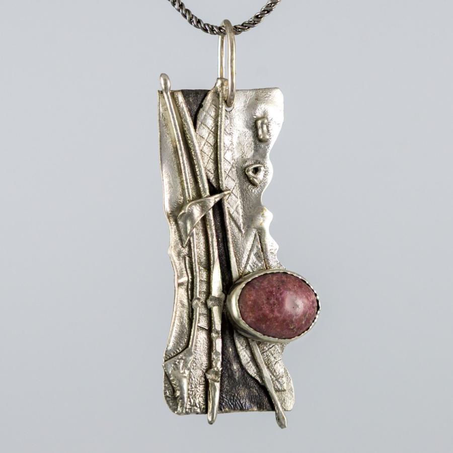 Rough silver pendant with pink stone