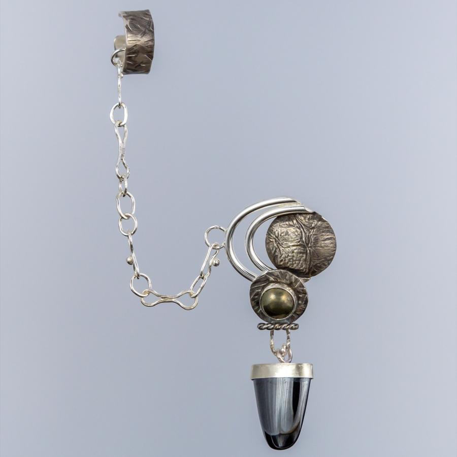 Earring connected to an ear cuff with a chain