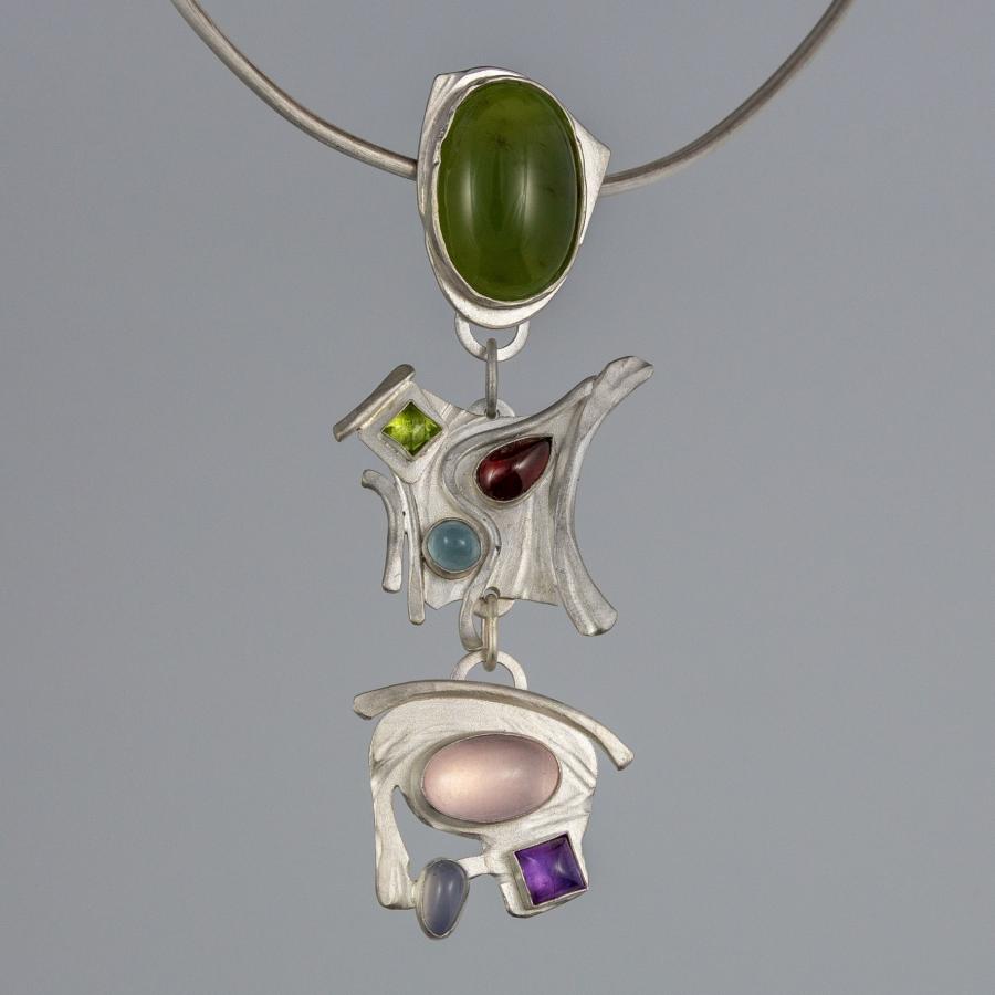 Silver pendant with multi-colored stones.