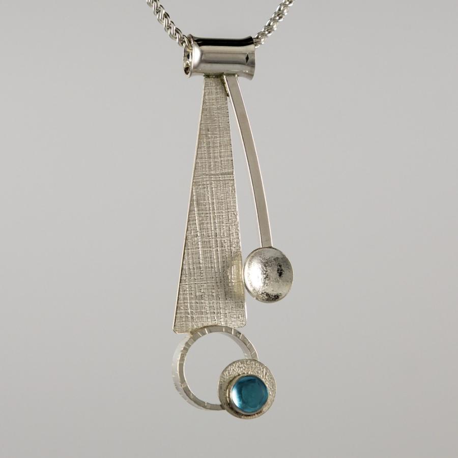 Silver pendant with a blue stone