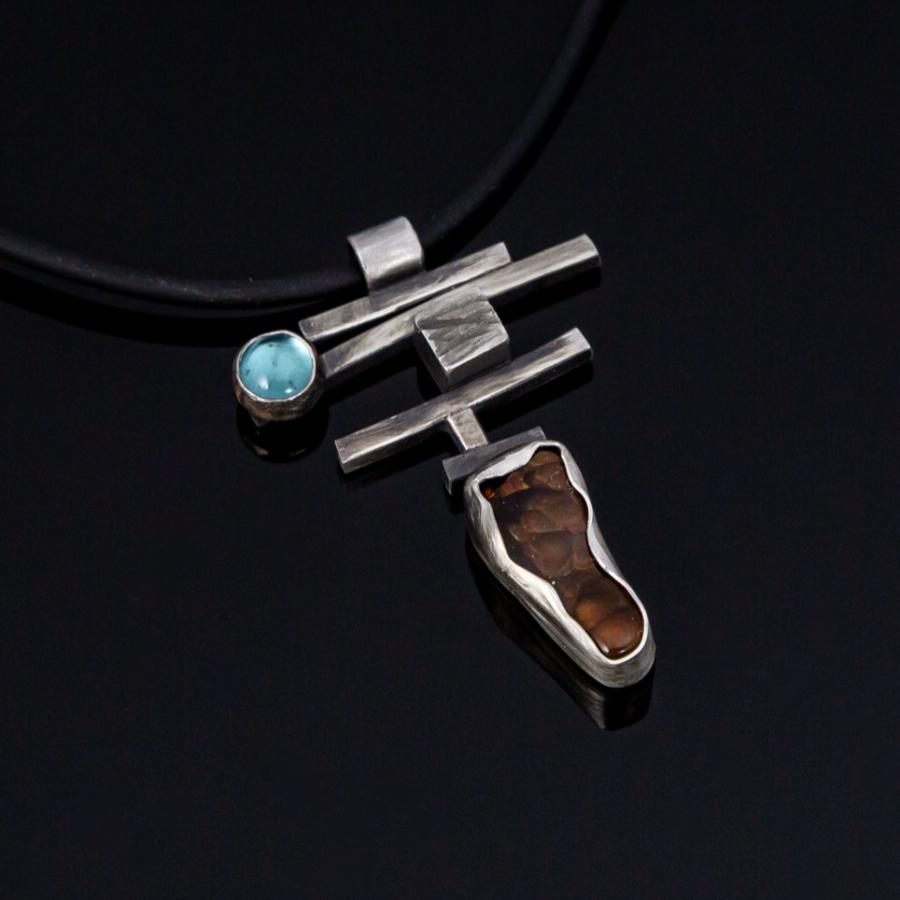 Silver pendant with blue and brown stones