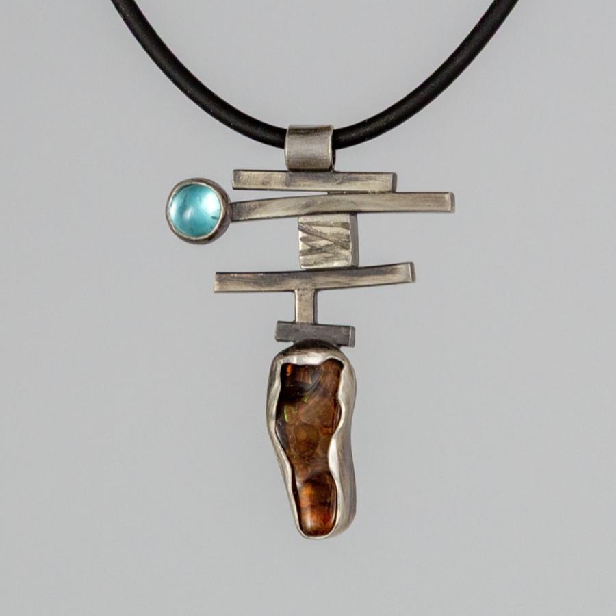 Silver pendant with blue and brown stones