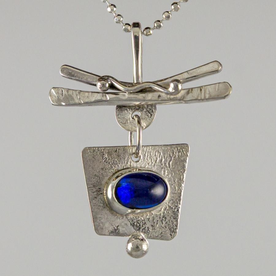 Silver pendant with blue stone