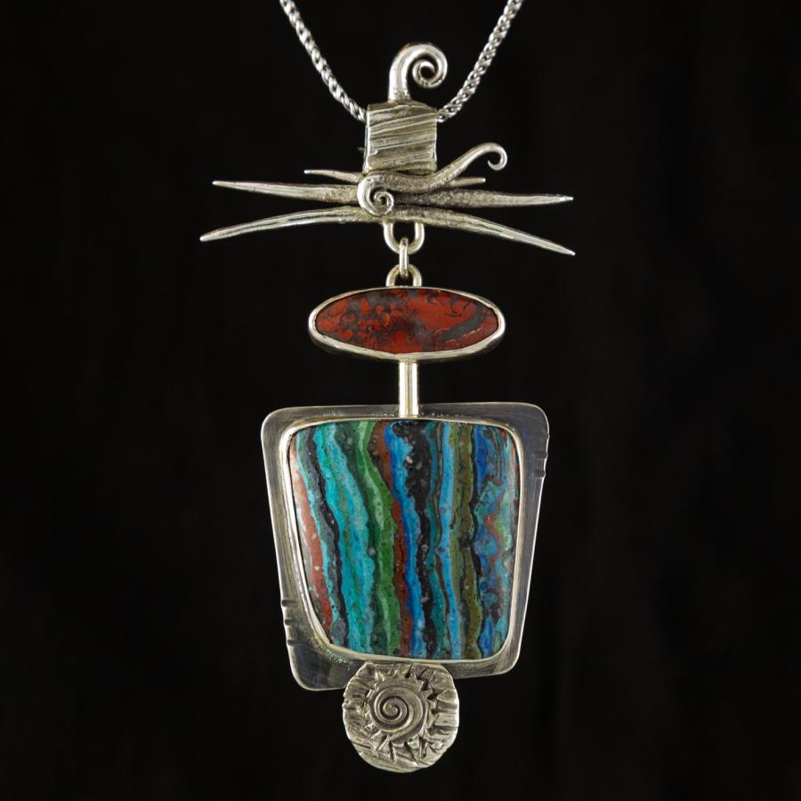 Silver pendant with two brightly colored stones