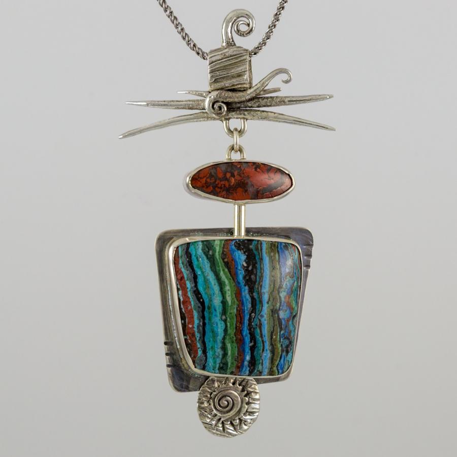 Silver pendant with two brightly colored stones