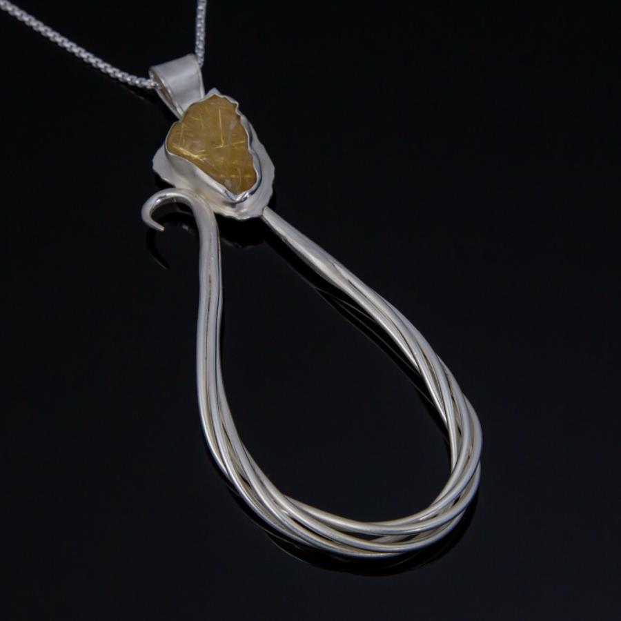 Silver pendant with a yellow stone
