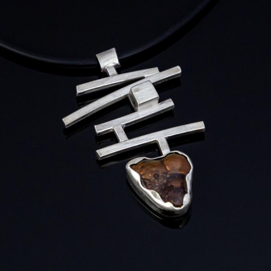 Silver pendant with brown stone