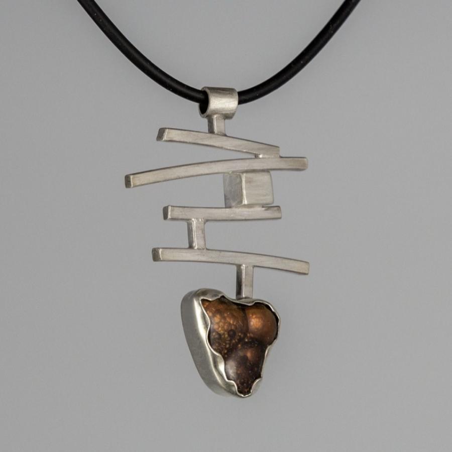 Silver pendant with brown stone