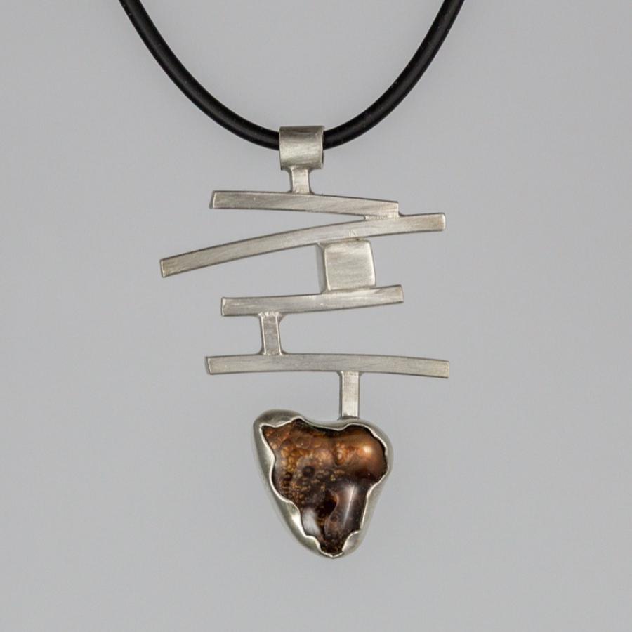 Silver pendant with brown stone