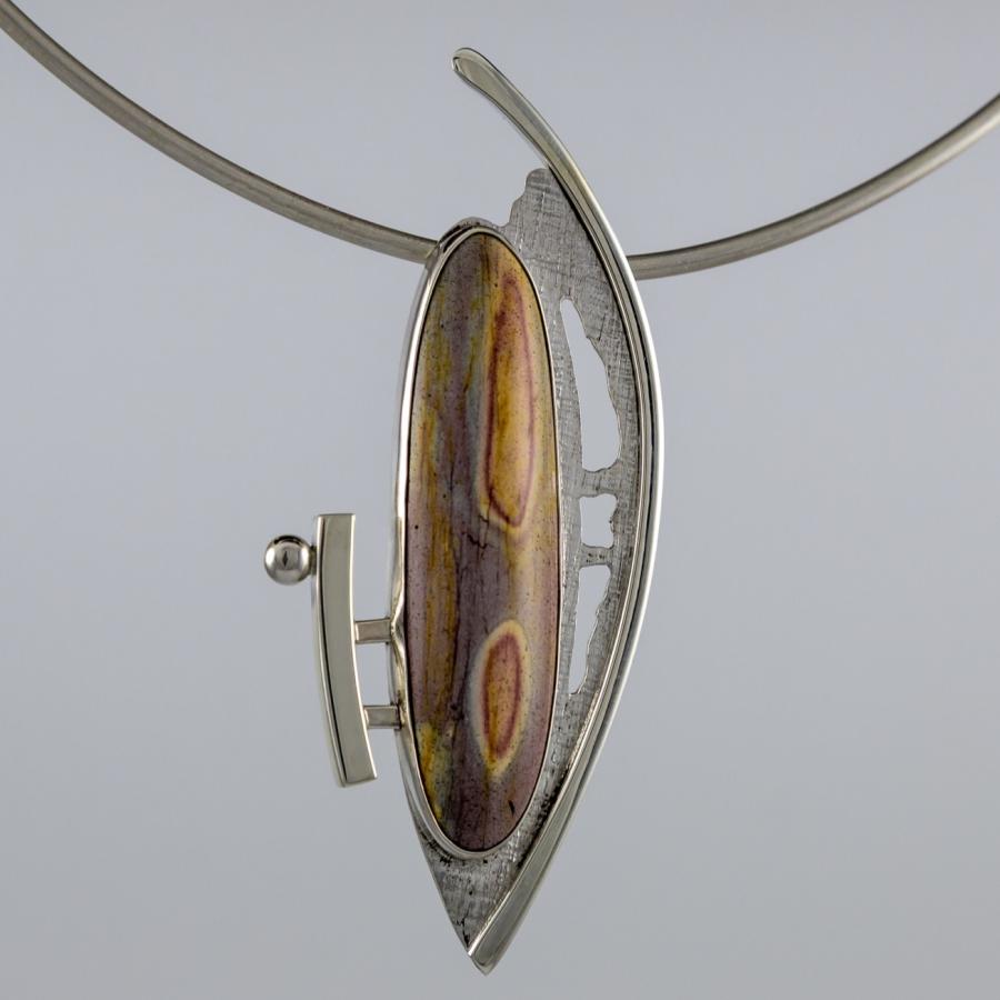 Silver pendant with a long oval multi colored stone
