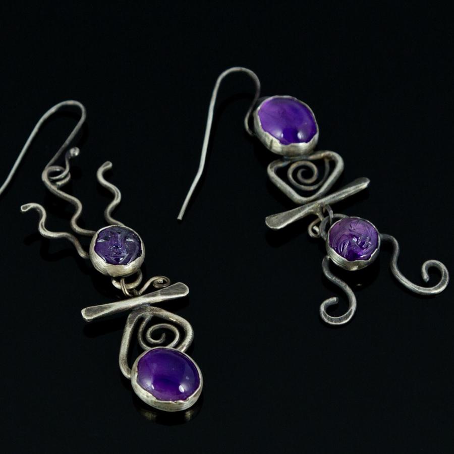Earrings with purple stones