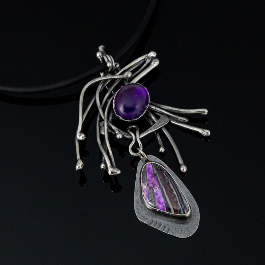 Silver pendant with purple stones