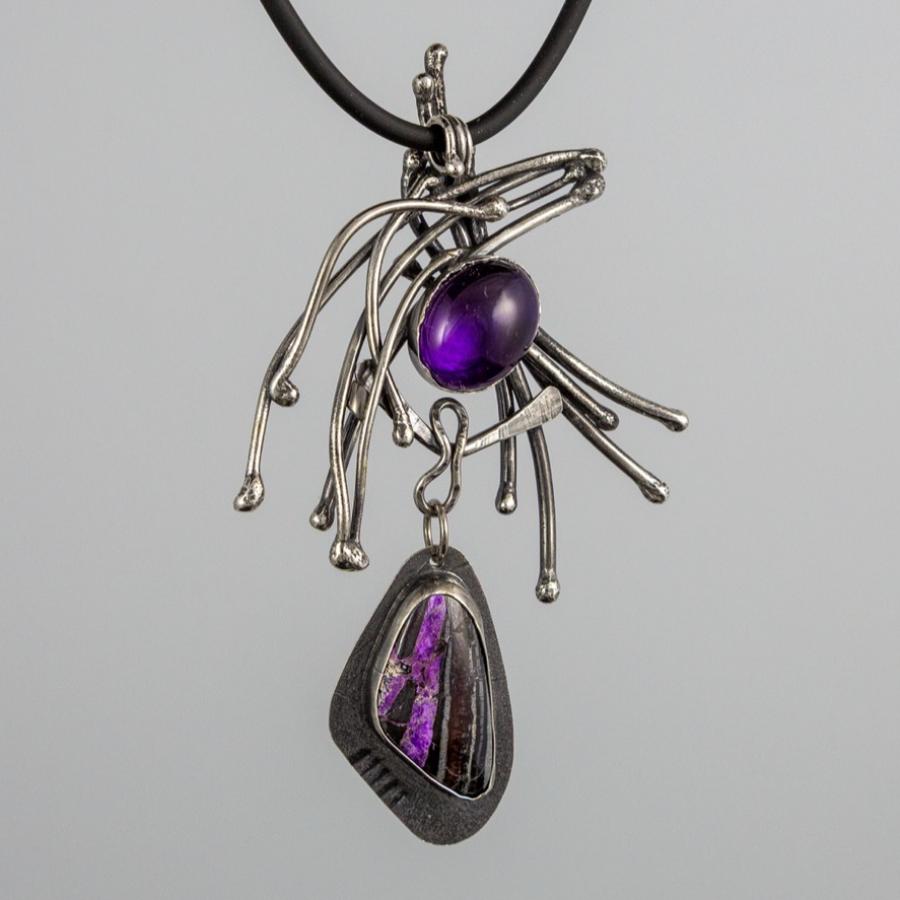 Silver pendant with purple stones
