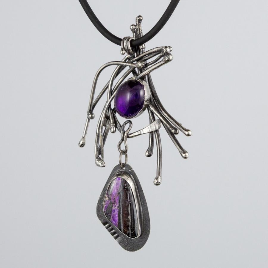 Silver pendant with purple stones