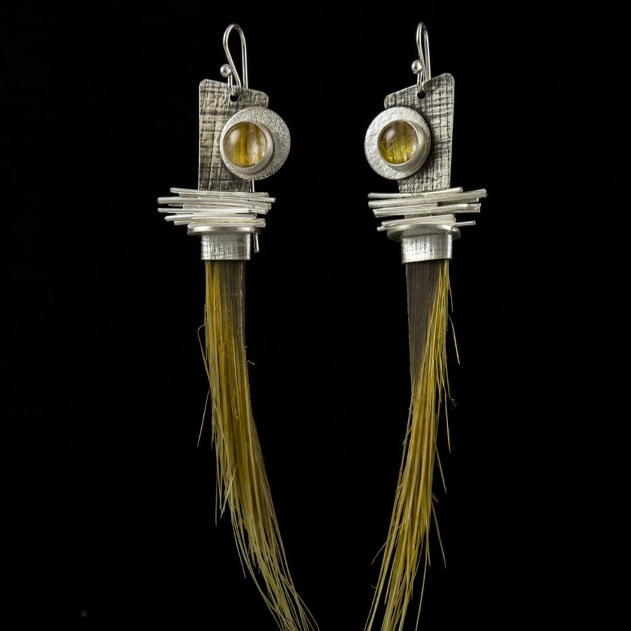 Silver earrings with yellow stones and hair like strands