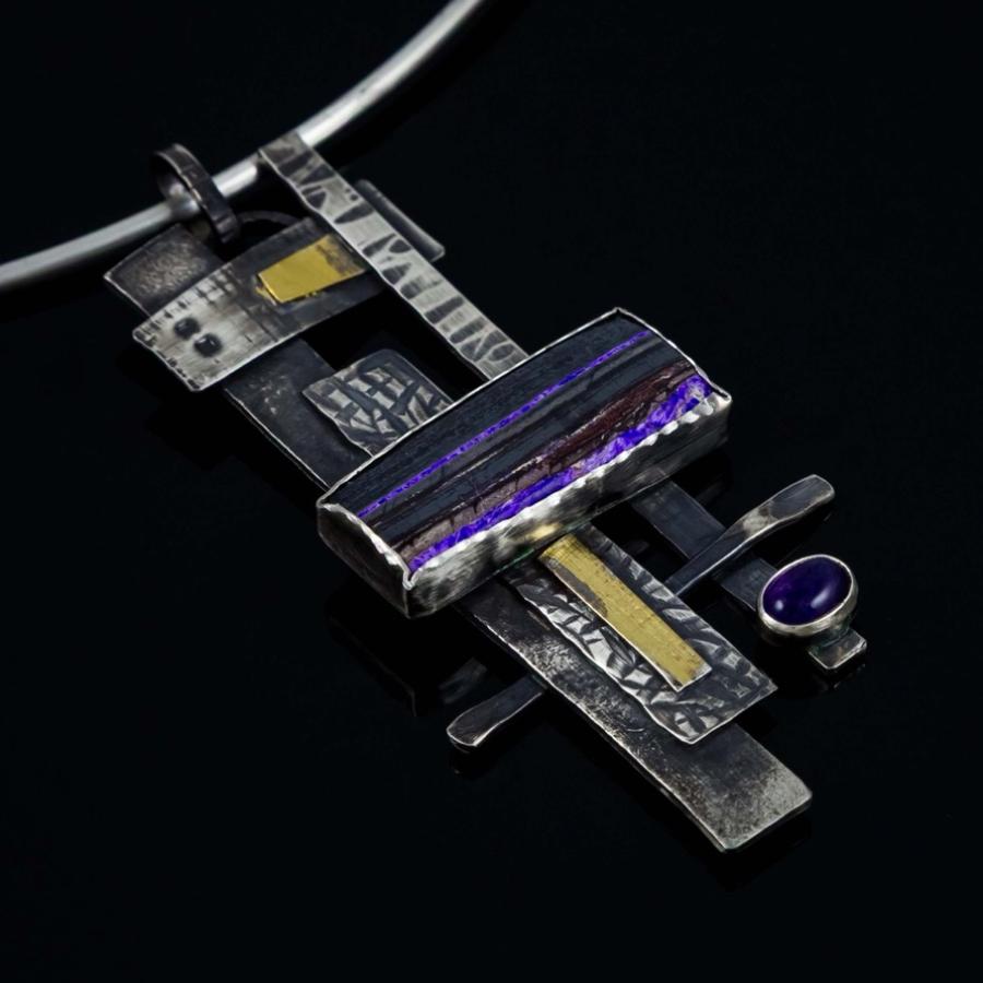 Silver pendant with purple stones and gold accents