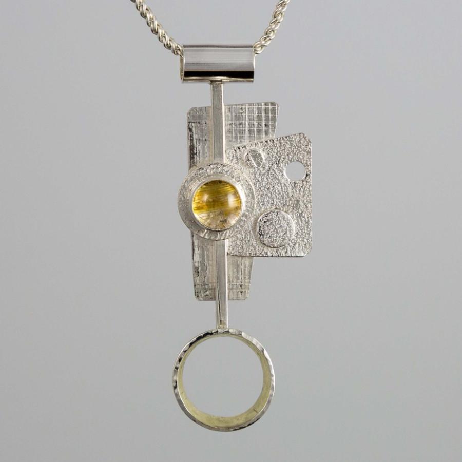 Silver pendant with a yellow stone