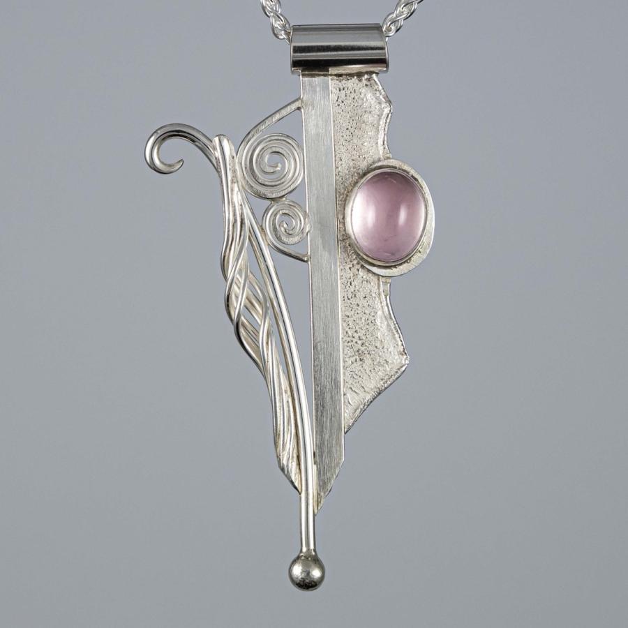 Silver pendant with a pink stone