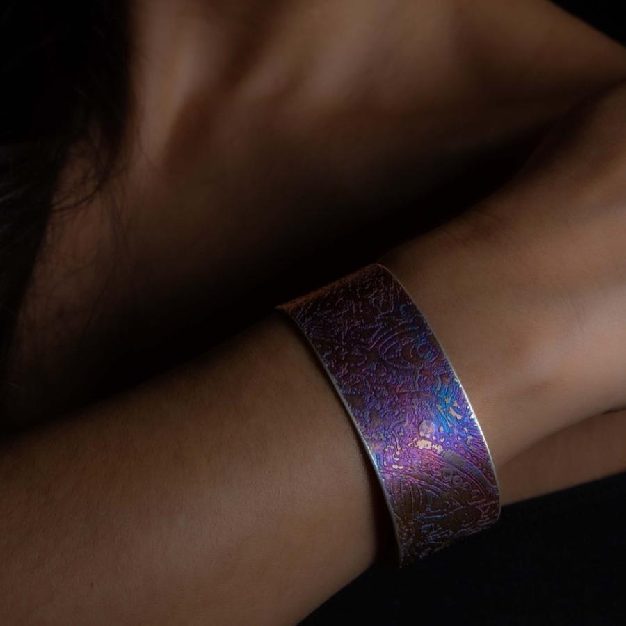 Model wearing a colorful cuff bracelet