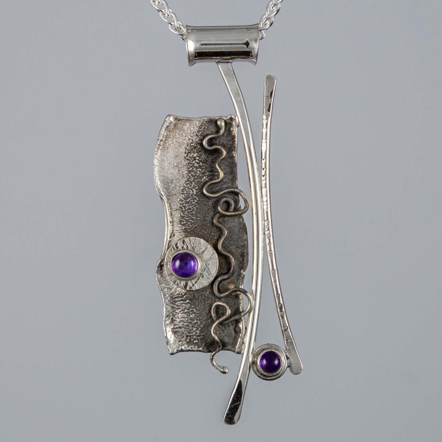 Silver pendant with purple stones
