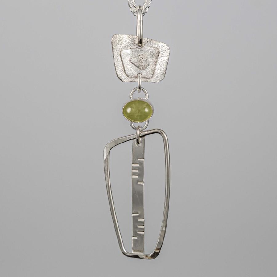 Silver pendant with green stone
