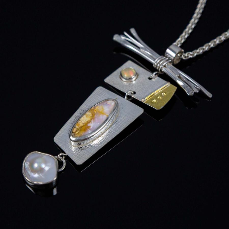 Silver pendant with a pearl, opal, and gold accents