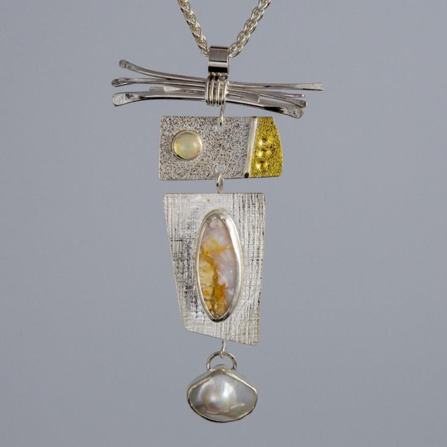Silver pendant with a pearl, opal, and gold accents