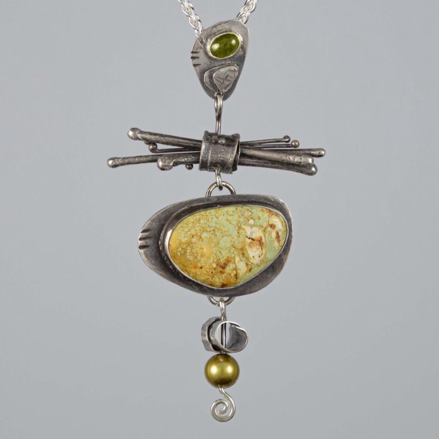 Silver pendant with a green stone
