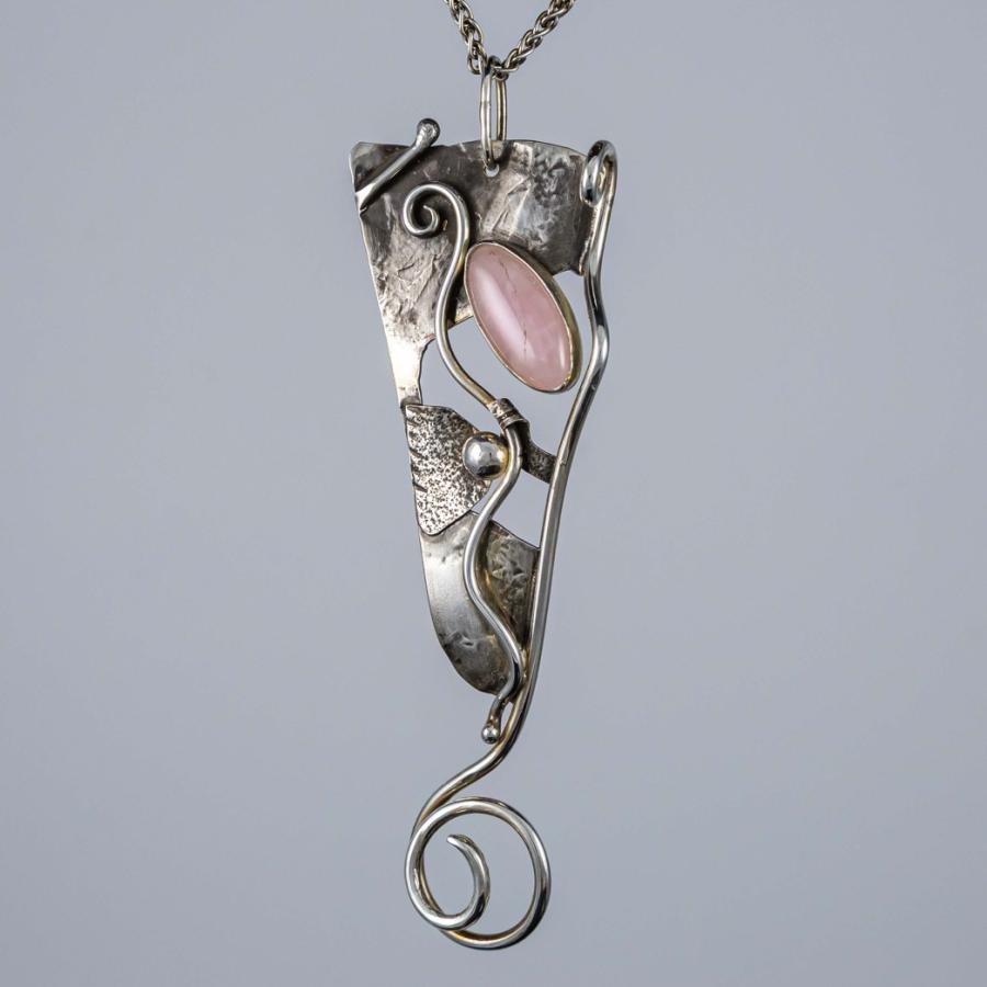 Silver pendant with a pink stone
